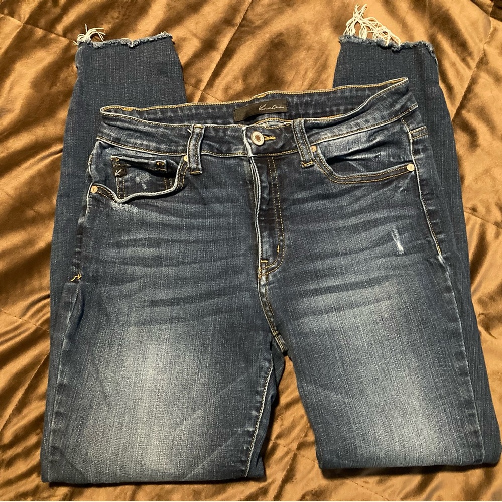 KanCan, size 9/28, darker wash, small bit of distressing, fringed bottom